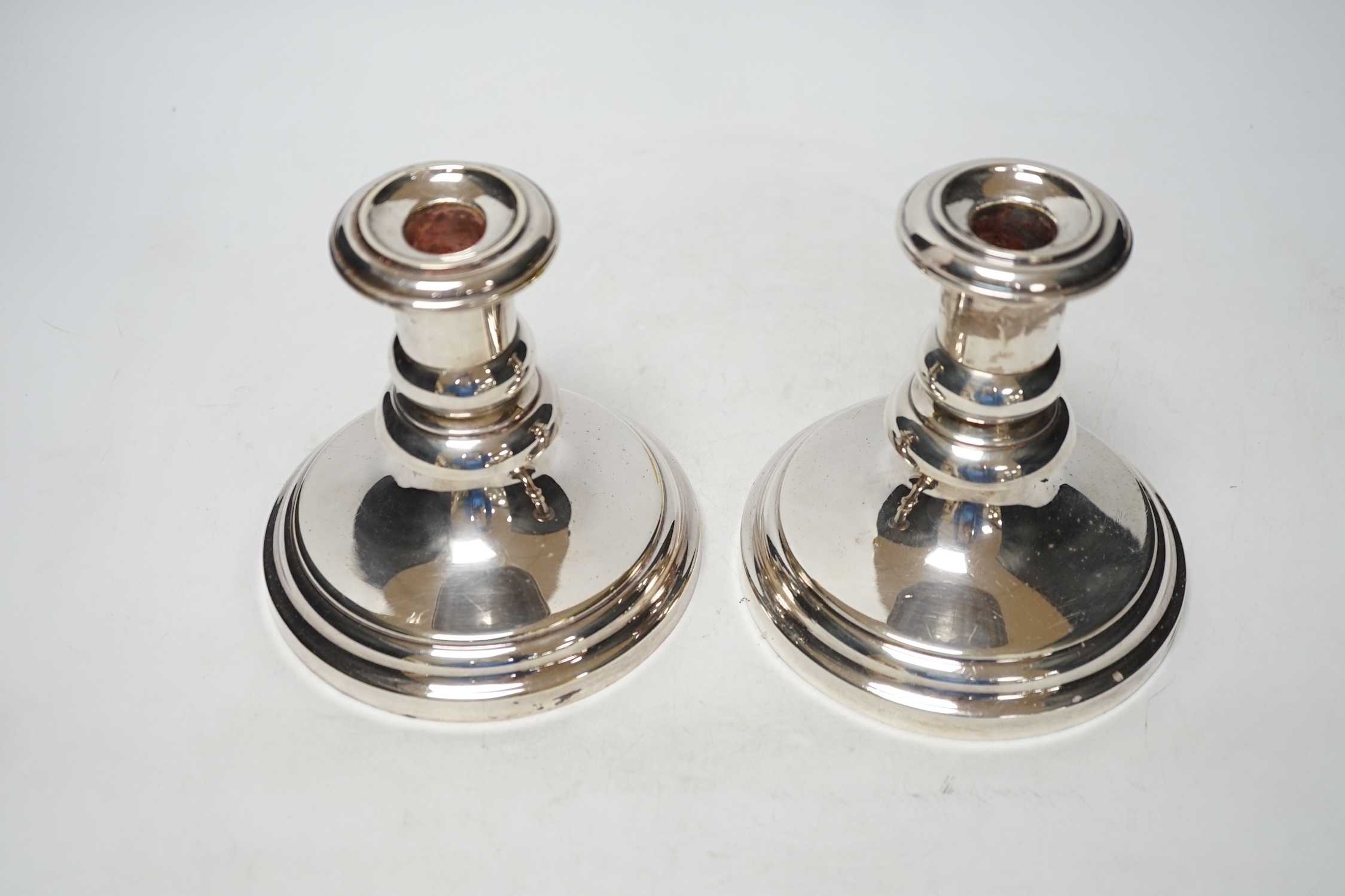 A pair of French Christofle silver plated dwarf candlesticks, 14cm